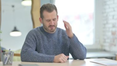 Tired Mature Adult Man with Headache at Work, Migraine