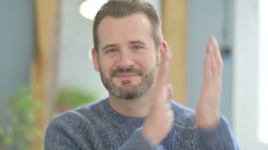 Mature Adult Man Clapping in Appreciation