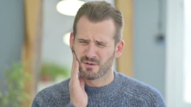 Portrait of Mature Adult Man with Toothache