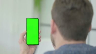 Mature Adult Man Using Smartphone with Green Screen