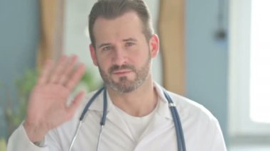 Doctor Talking on Video Call in Clinic