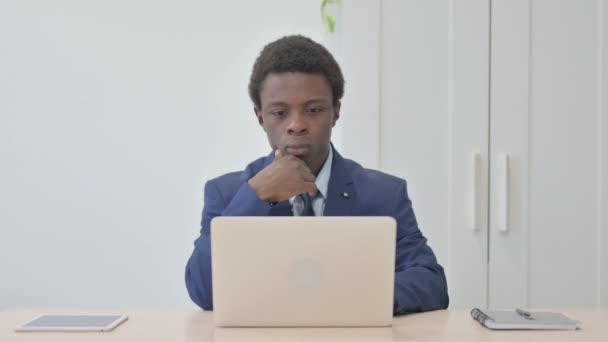 Young African Businessman Brainstorming While Working Laptop — Stock video
