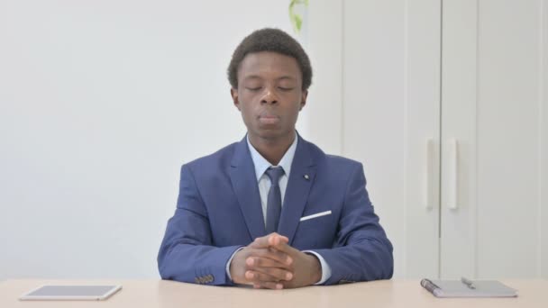 Pensive Young African Businessman Thinking While Sitting Work — Stok Video