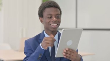 Young African Businessman Doing Online Video Chat on Tablet