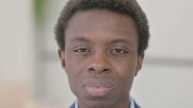 Close Up of Young African Businessman with Toothache