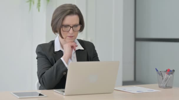 Old Senior Businesswoman Thinking While Working Laptop — Video