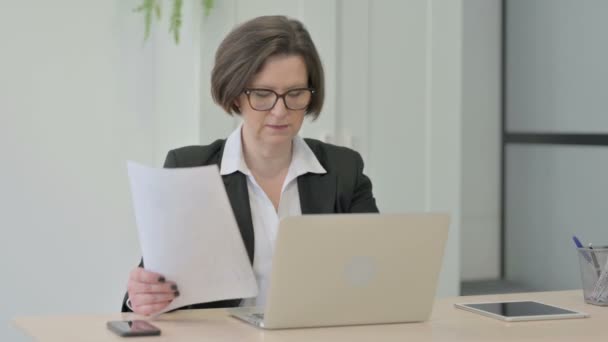 Old Senior Businesswoman Feeling Upset While Doing Paperwork — Video