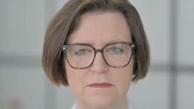 Close Up of Serious Old Senior Businesswoman Face