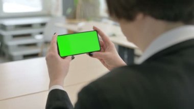 Old Senior Businesswoman Watching Smartphone with Green Screen