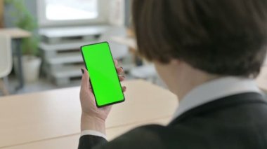 Old Senior Businesswoman Using Phone with Green Chroma Screen
