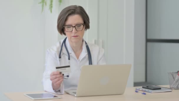 Senior Female Doctor Making Paying Online Credit Card — Video Stock