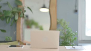 African Man Coming Back to Office for Working on Laptop