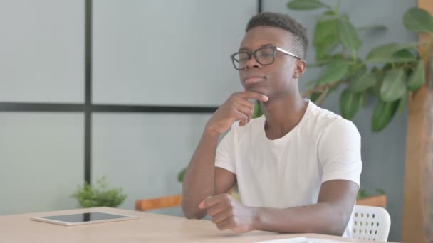 Pensive Young African Man Thinking While Sitting Work — Wideo stockowe