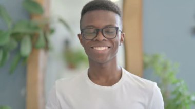 Portrait of Young African Man Shaking Head in Approval