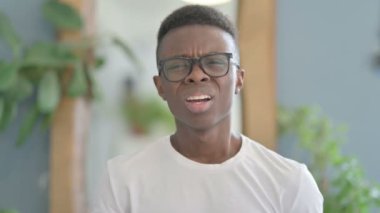 Shocked Young African Man Wondering in Awe, Astonished