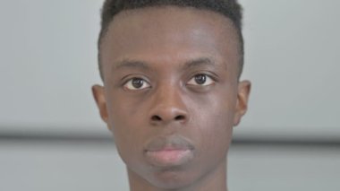 Close Up of Serious Young African Man Face