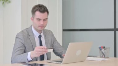 Young Businessman Unable to make Online Payment on Laptop