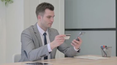 Young Businessman Shopping Online with Phone, Banking