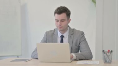 Call Me Gesture by Young Businessman Pointing at the Camera at Work