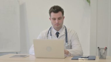 Call Me Gesture by Young Doctor at Work
