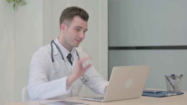 Young Doctor Doing Online Video Chat Clinic — Stockvideo