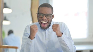 Portrait of Successful African American Man Celebrating Achievement