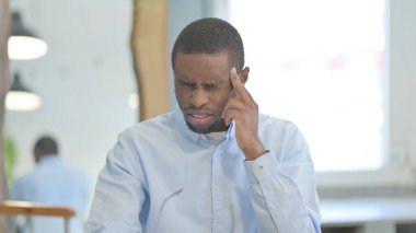 Portrait of Tense African American Man with Headache