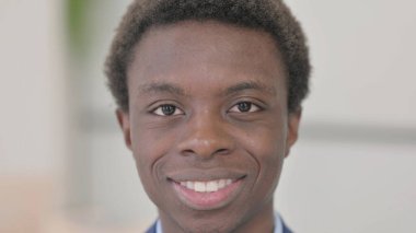 Close Up of Smiling Young African Businessman Face
