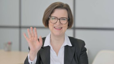 Old Senior Businesswoman Waving Hand to Say Hello
