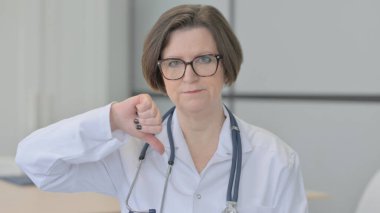 Portrait of Old Female Doctor Doing Thumbs Down