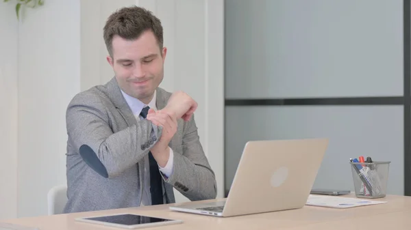 Young Businessman Wrist Pain Working Laptop — Stockfoto