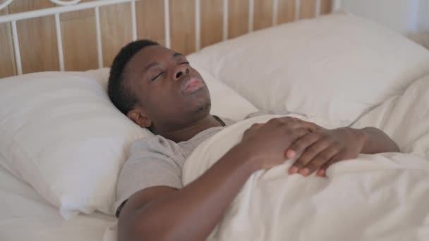 Sick Young African Man Coughing While Lying Bed — Stock Video