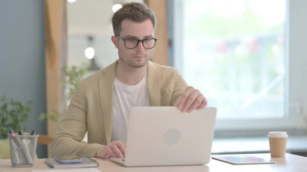 stock image Young Businessman Coming to Office and Starting Work on Laptop