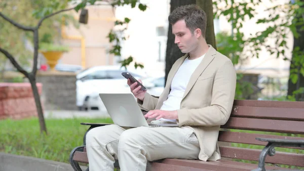 Casual Young Man Working Laptop Smartphone — Stock Photo, Image