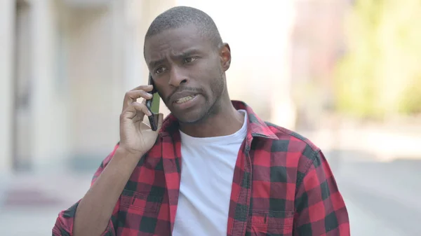 African American Man Talking on Phone Outdoor