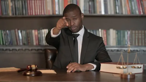 African Male Lawyer Pointing at Camera in Office