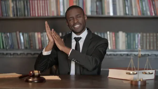 Excited African Male Lawyer Clapping for Team in Office