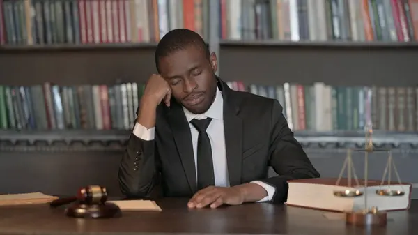 Tired African Male Lawyer Sleeping in Office