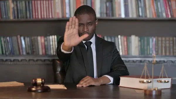 African Male Lawyer with Stop Gesture