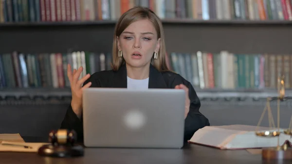 Young Female Lawyer Shocked by Loss on Laptop