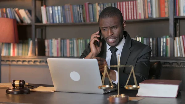 African American Lawyer Talking on Phone with Client