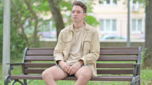 Coughing Casual Young Man Sitting Outdoor — Stock Video