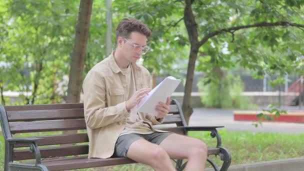 Modern Young Man Reading Documents Outdoor — Stock Video