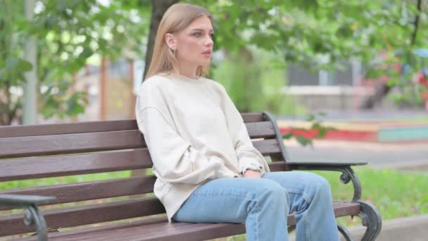 Coughing Young Woman Sitting Outdoor — Stock Video