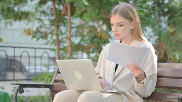 Young Business Lady Working on Documents Outdoor