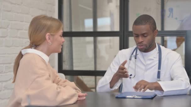 African Doctor Discussing Medical Report Patient — Stock Video