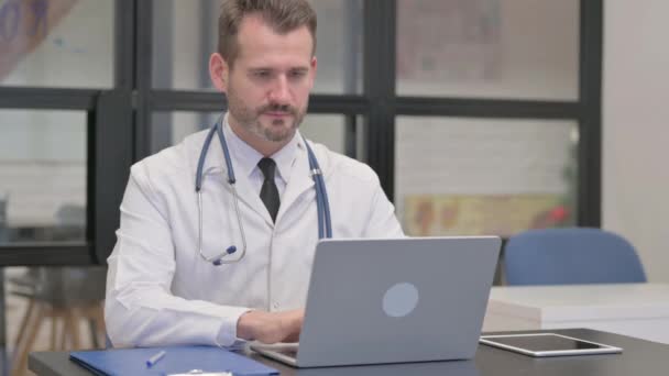Middle Aged Doctor Typing Laptop — Stock Video