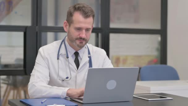 Middle Aged Doctor Looking Camera While Working Laptop — Stock Video