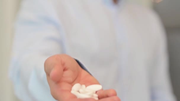 Man Pills Hand Offering Tablets — Stock Video