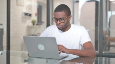 African American Man Working on Laptop